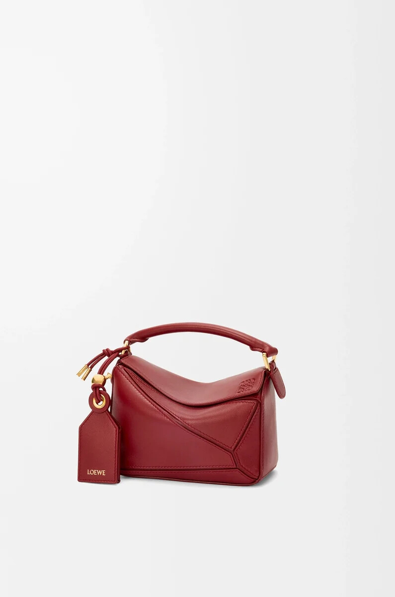 bolso mini featherlight puzzle en piel de cordero napa color rojo quemado